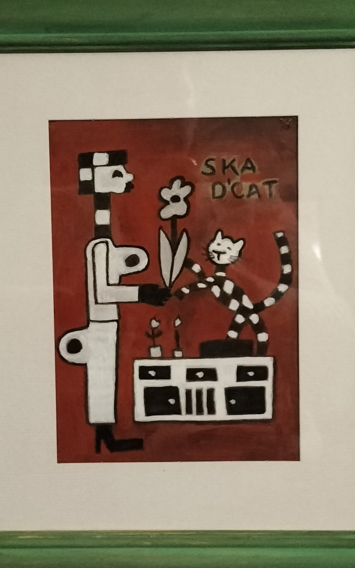Ska d'cat art work - illustration two tone cat on sideboard with blowers and next to a figure standing up