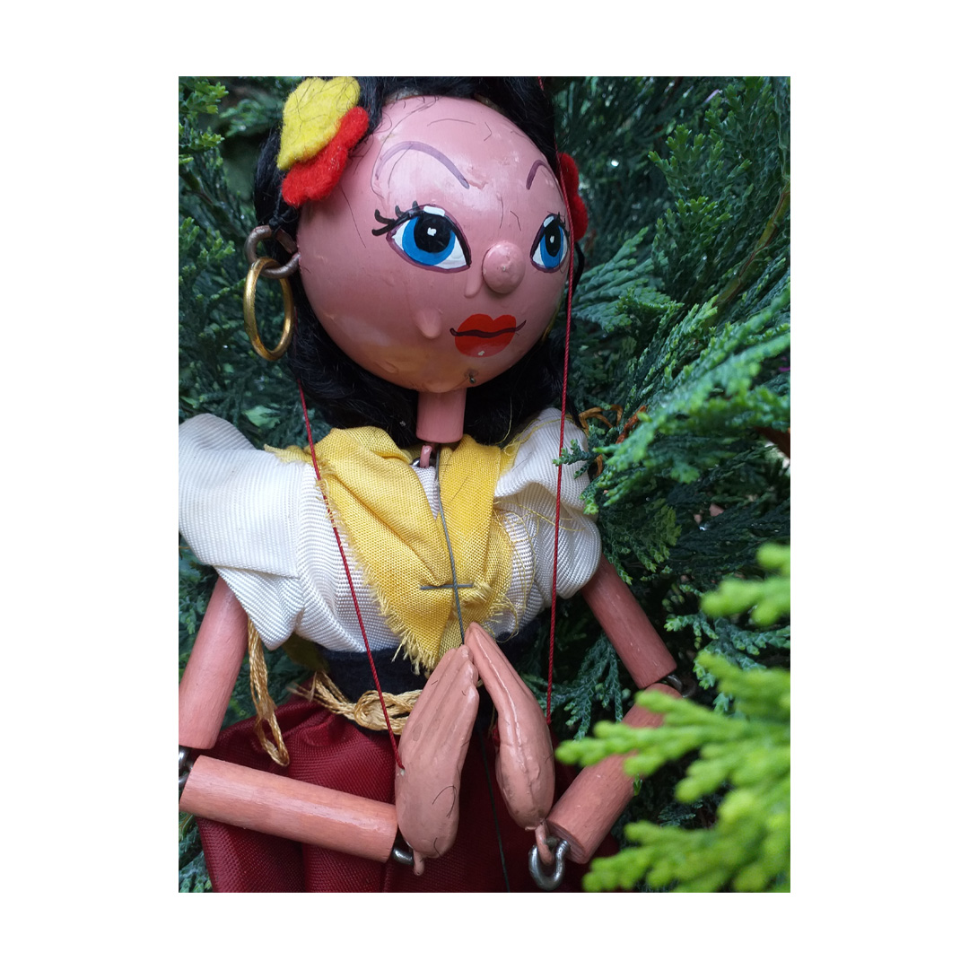 Vintage Pelham gypsy puppet photographed in rain to look like a tear on her face