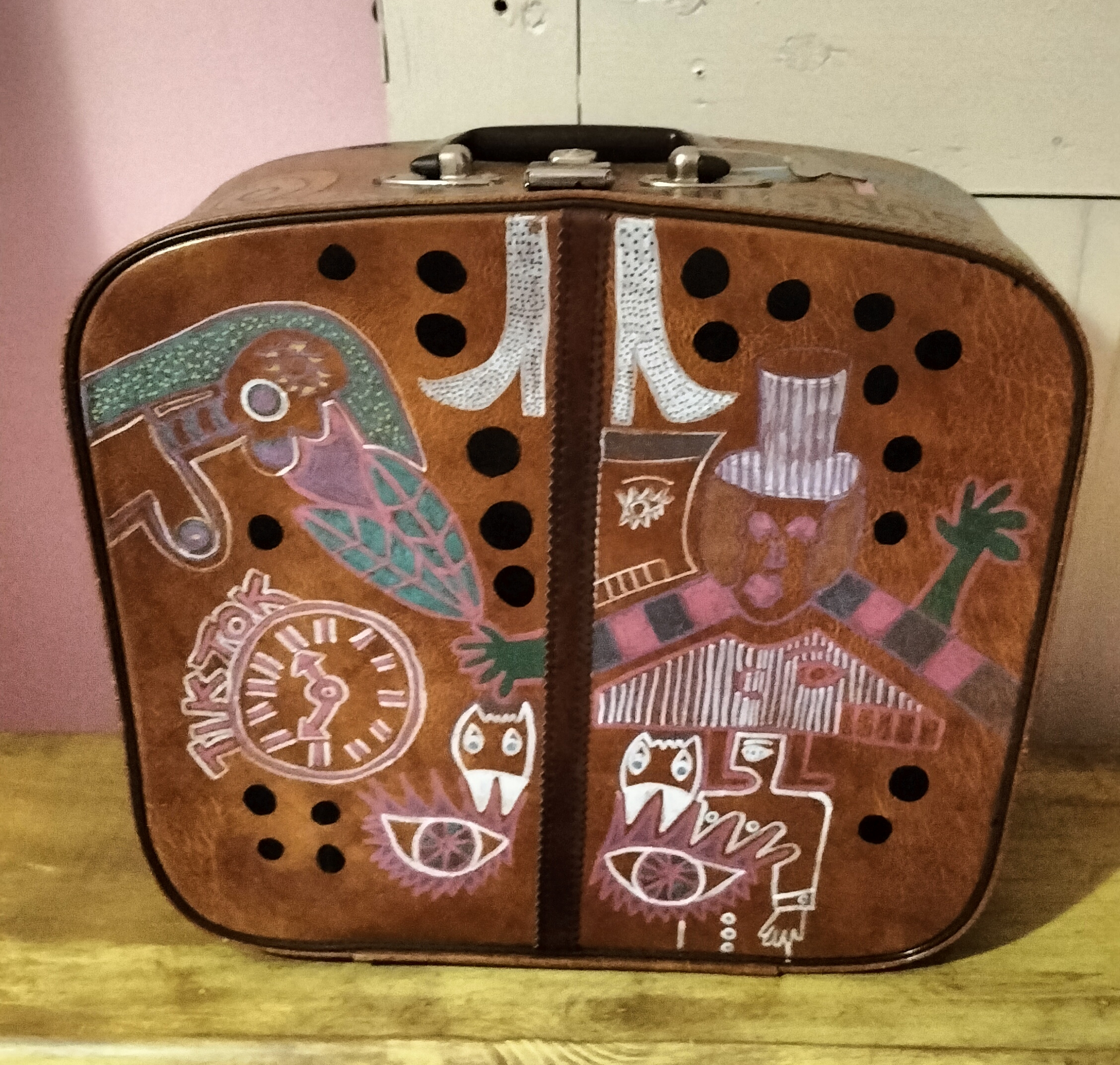 I want your baby daddy hand painted vintage vanity case. This is the top of the case and shows illustration of characters, eyes and TikTok. Boots and hands. Brown vintage case hand painted on all sides.