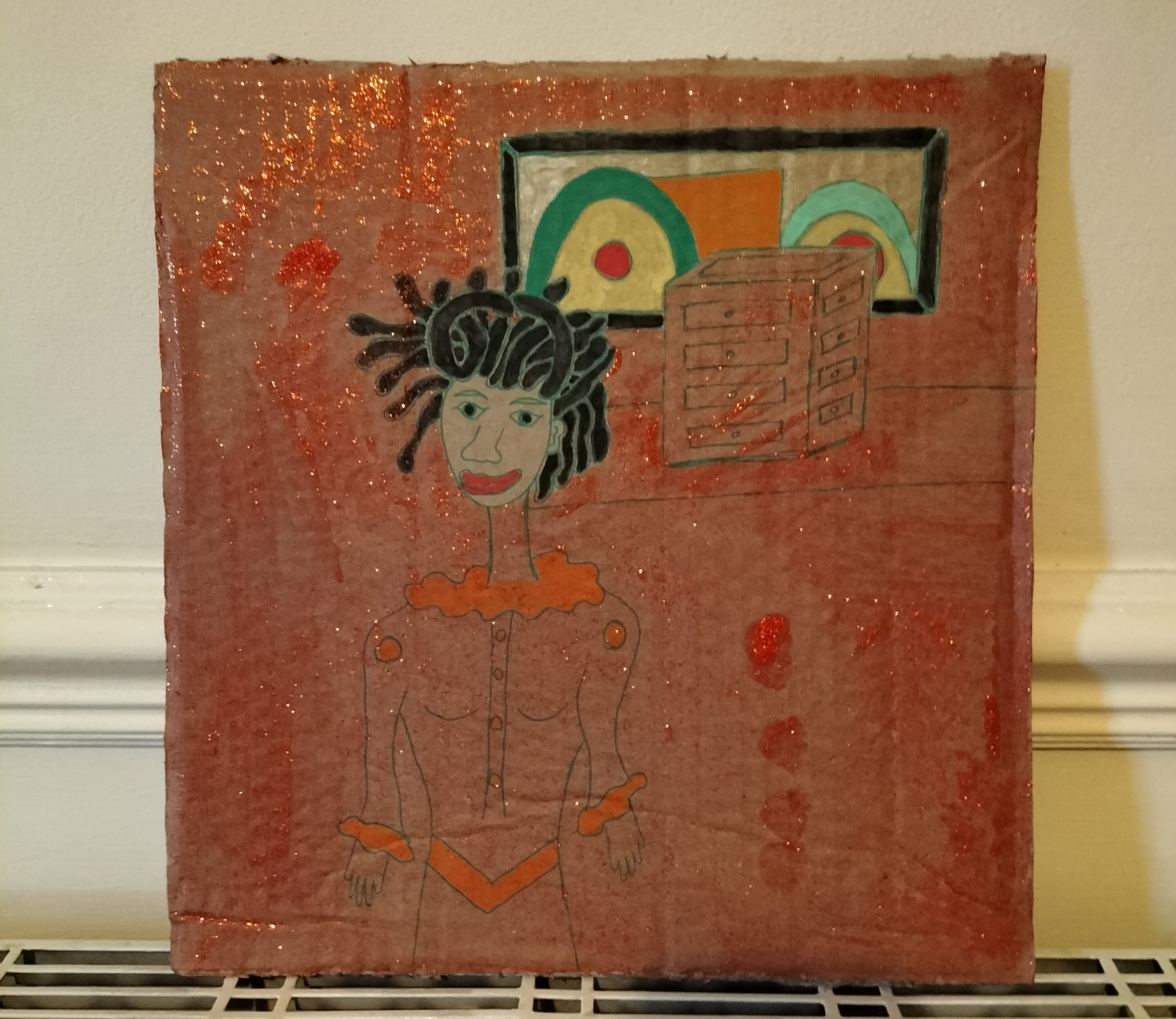 Cardboard art - black woman with window and cube structure. Woman has African features. Red background for the whole image apart from the woman's face.