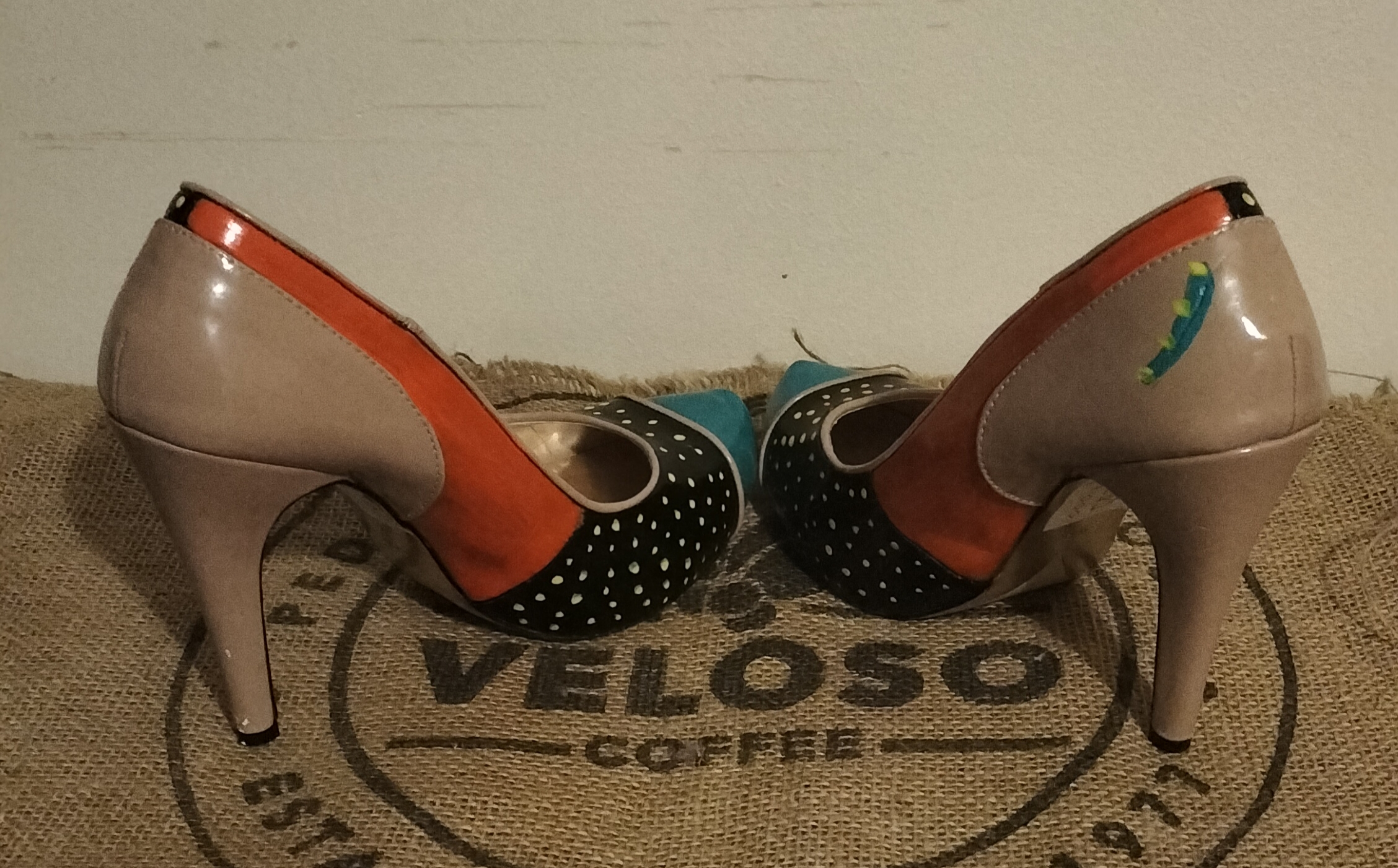 Size 6 hand painted Ben de Lisi shoes. Turquoise toes, black sections with gold spots at the front and side. Orange panels. Beige shoes, stiletto heels.