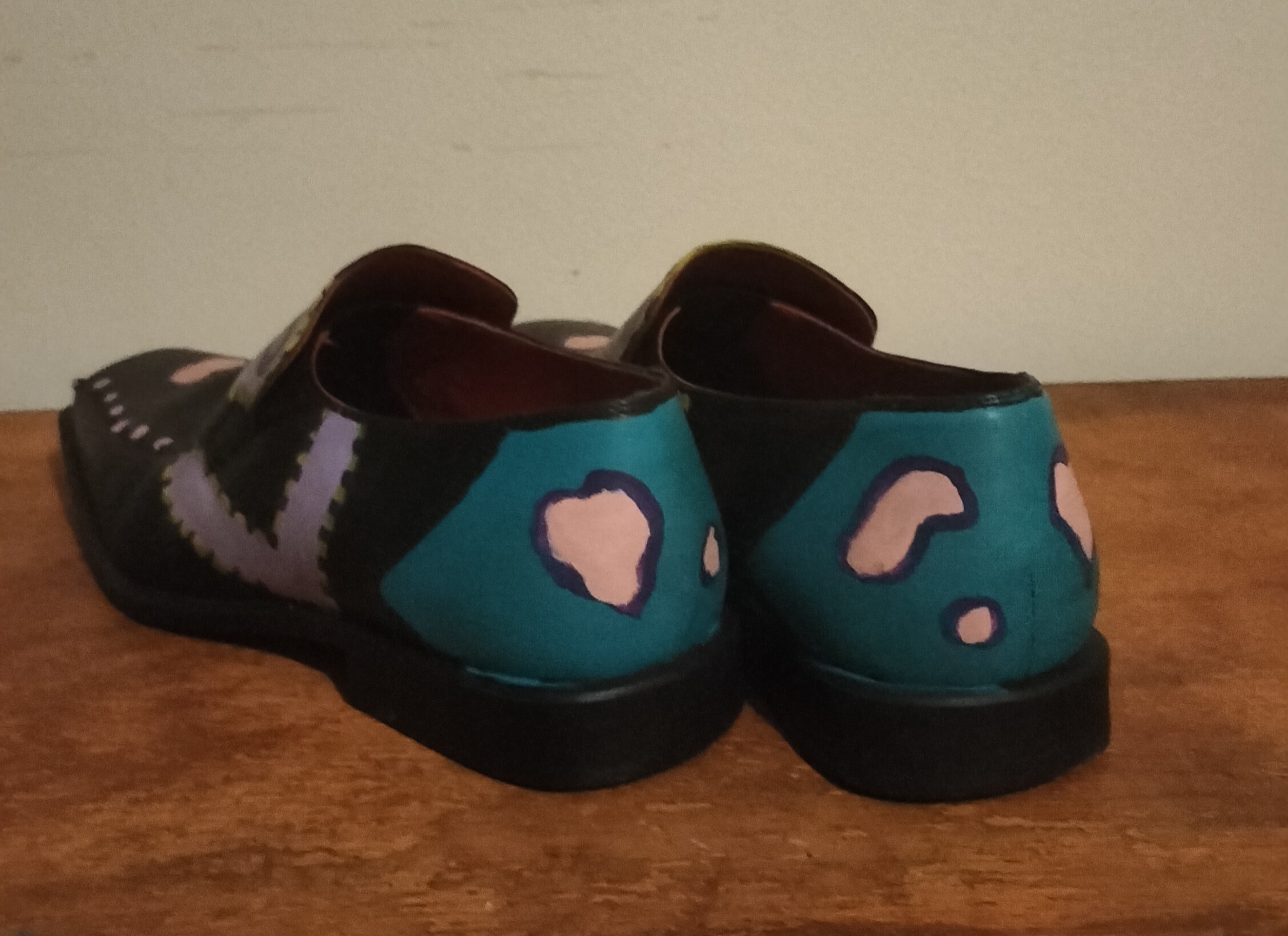 Hand painted black shoes with Hip Hop painted on them.  This is the back section which is turquoise and liver shaped pink areas.  Size 8 leather.