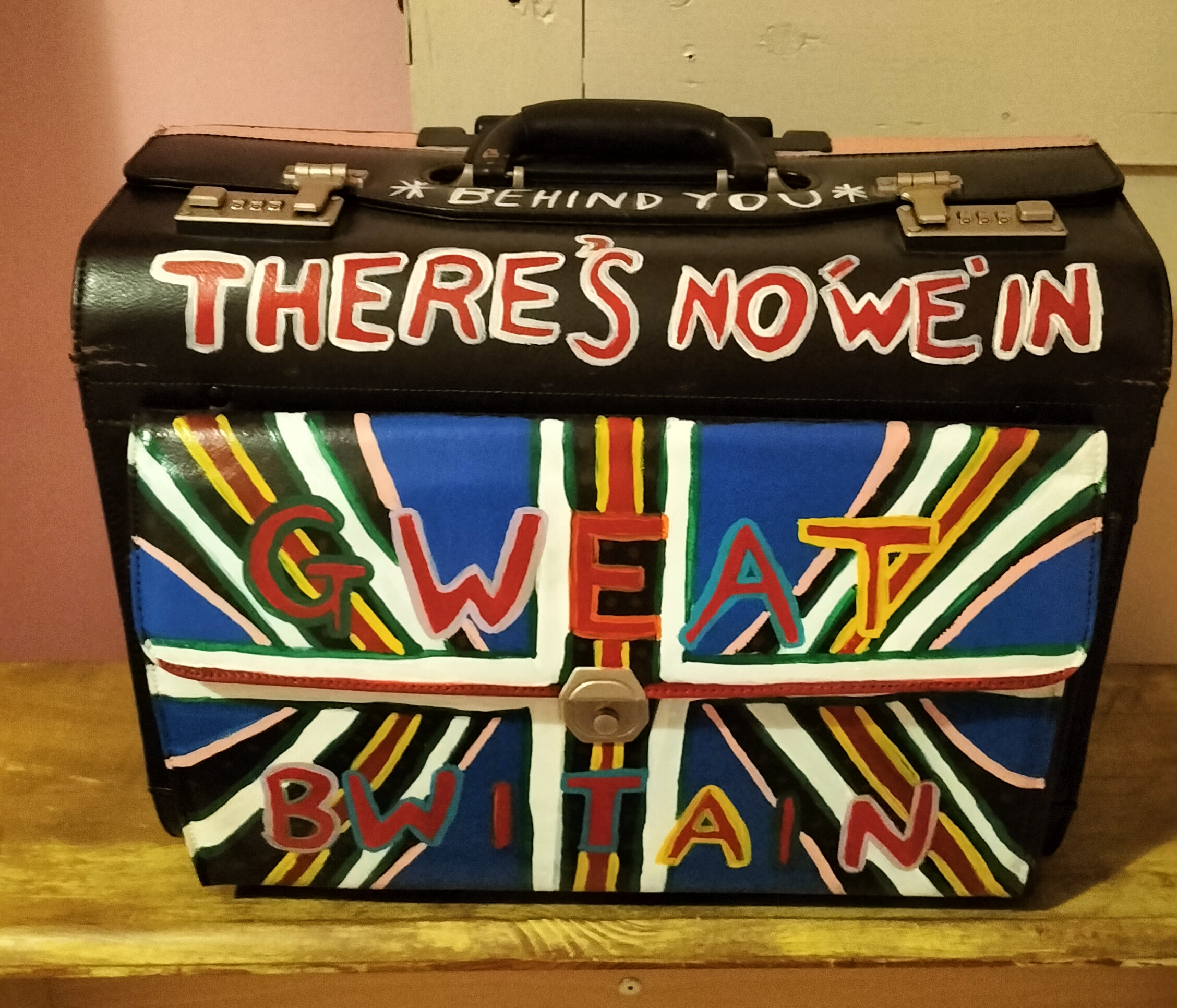 There's no we in Gweat Britain handpainted pilot case. Front of art work, British flag split upThere's no we in Gweat Britain handpainted pilot case. Front of art work, British flag split up with the words Gweat Bwitain over the flag. Referencing class and division based on race and identity. with the words Gweat Bwitain over the flag. Referencing class and division based on race and identity.