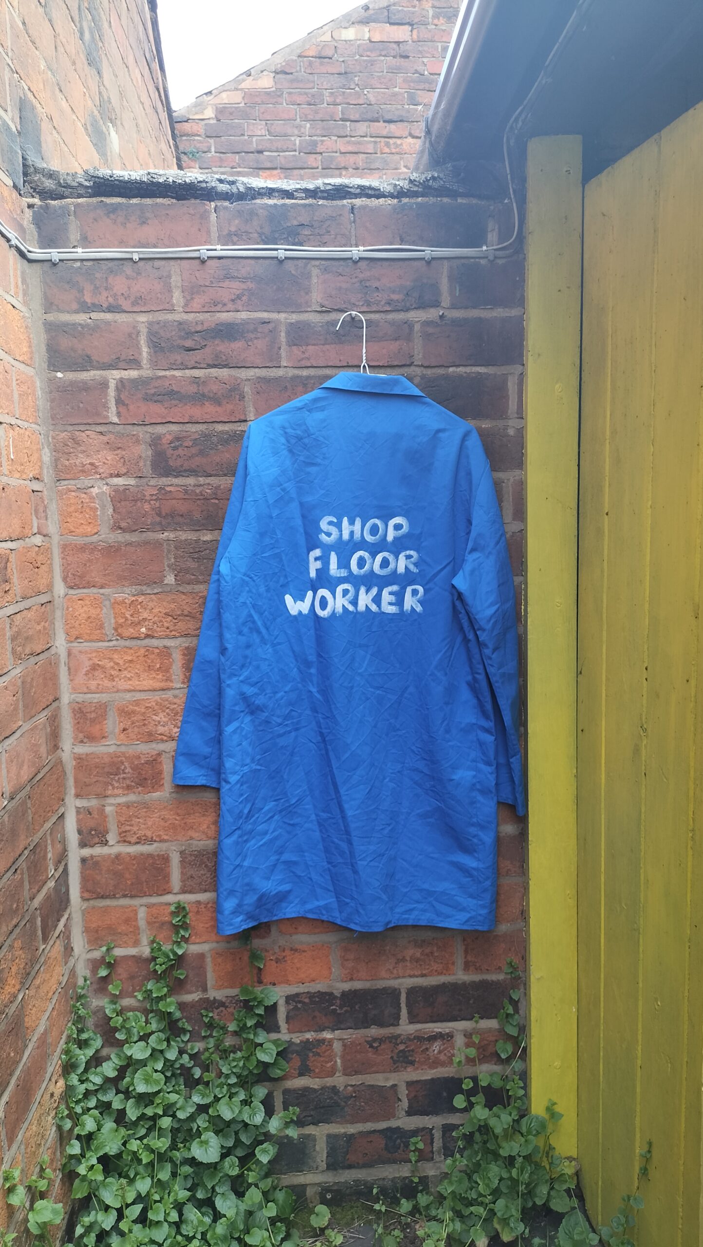 Hand painted French style worker overall. Lovely blue colour. "Shop floor worker" hand painted on the back of overalls. Front has a badge on it with Reichelbrau logo. Medium to large size. One off original.
