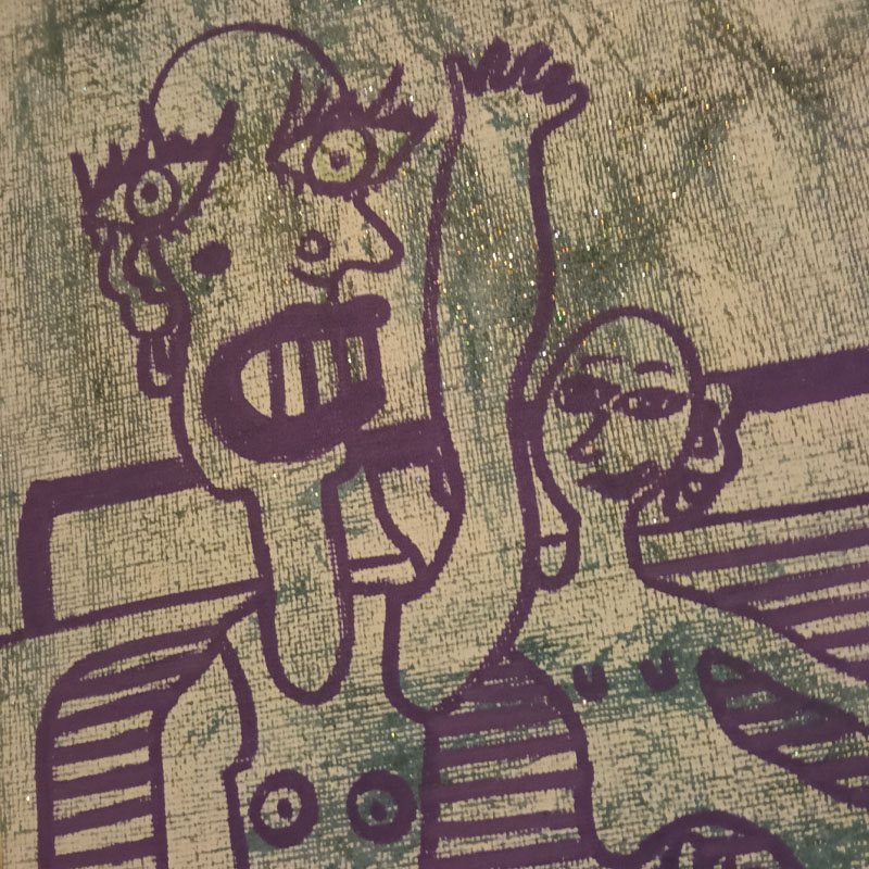Close up of canvas of figures with radio.