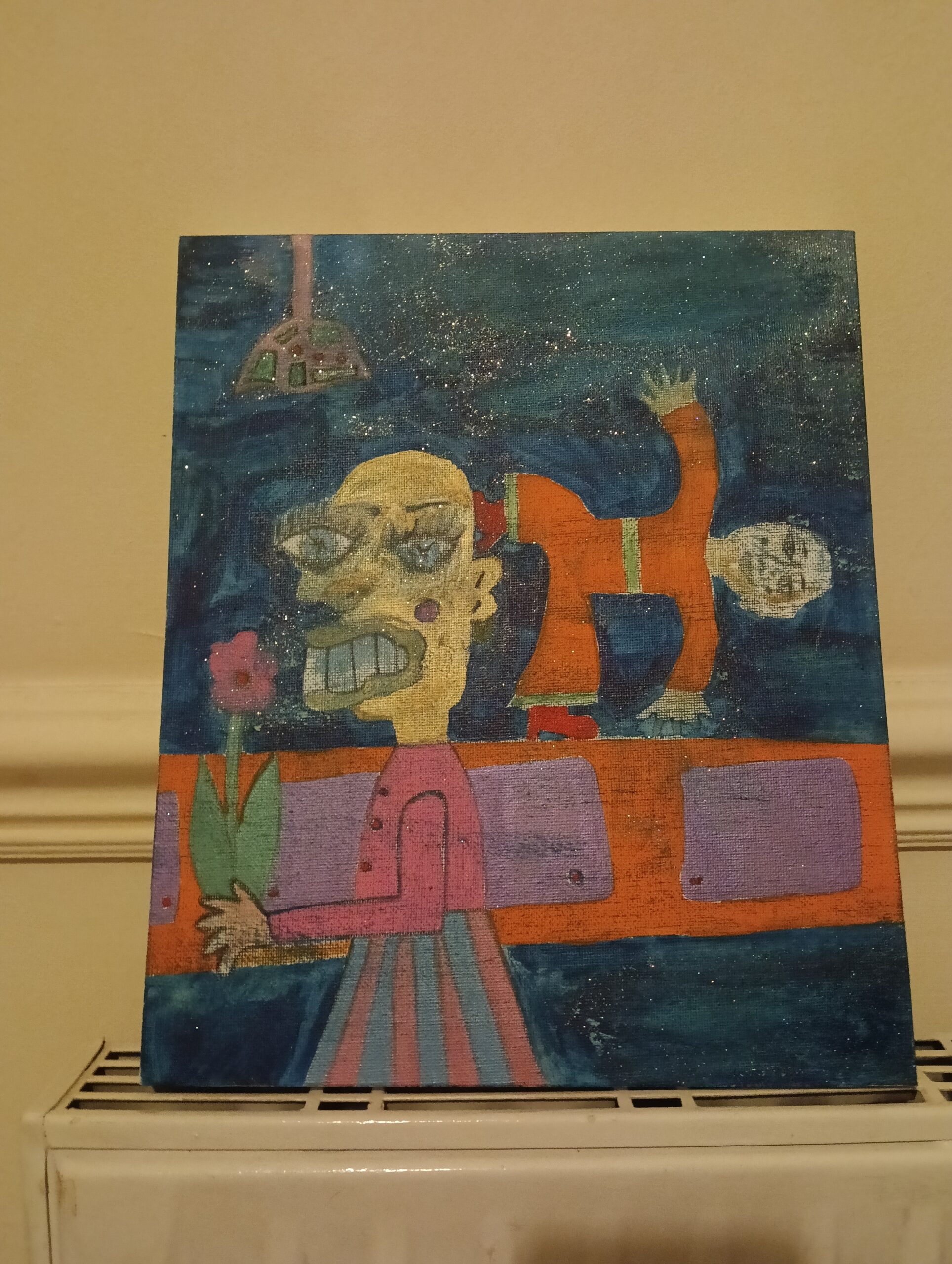 10" x 12" original canvas. A figure on the left holding a flower and behind them is a sideboard and a smaller character in an orange suit. There is a light hanging from the ceiling at the top of the image. Themes can be the alter ego with a large and small figure, memories or whatever else people want to interpret this as.