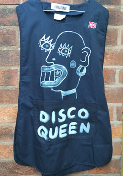 Tabard hand painted. Navy blue with face on the front in white paint. Words read "Disco Queen"