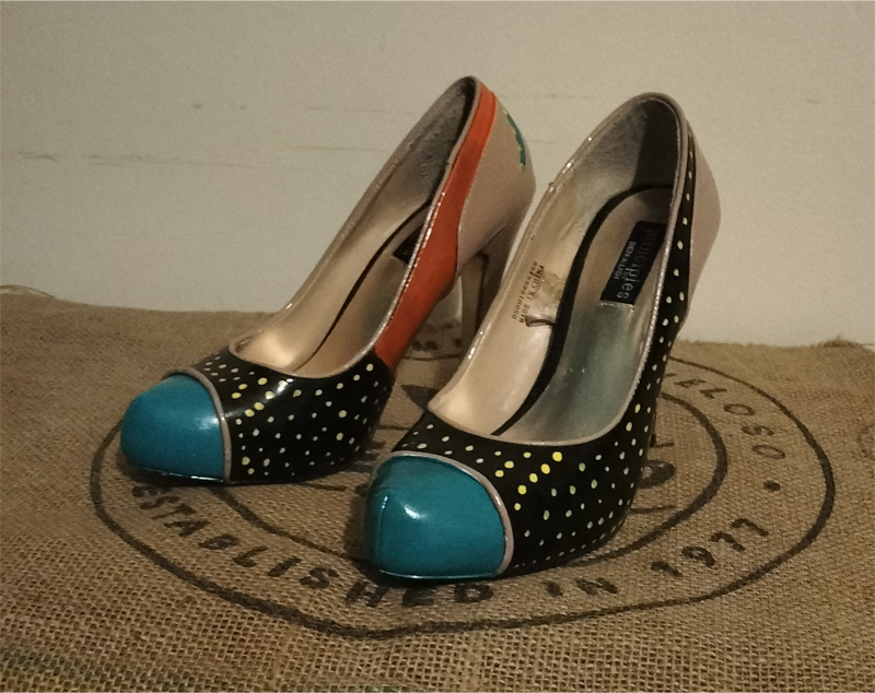 Ben de Lisi size 6 hand painted shoes. Main colour beige and painted with orange and turquoise colours with yellow dots. Sections of the shoes are painted. Stiletto heel. Original one-offs. Turquoise toe with black section behind with yellow spots. Orange panels on the inside of the shoes which extends to the back of the shoe around the top of the shoe.