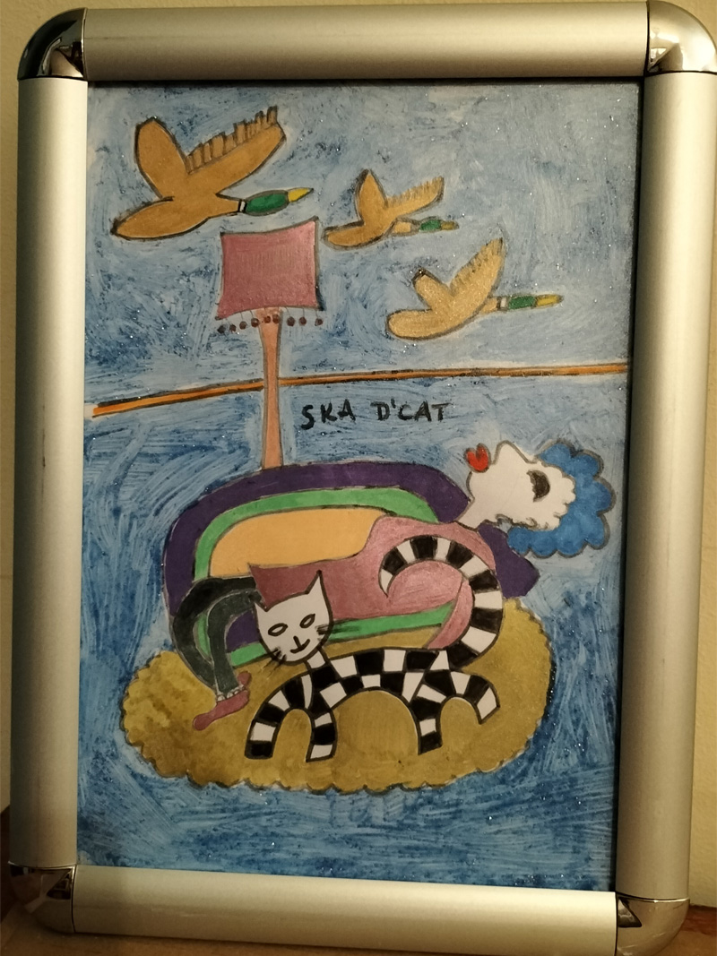 Ska d'cat original. Flying ducks on wall. Cat on rug on floor. Woman on sofa. Lounge scene.