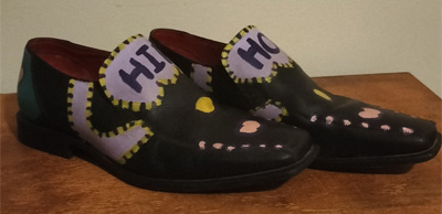 Size 8 hand painted black leather shoes. Words "Hip Hop" on the front of the shoes. Decorated on all areas. Shapes and colours.