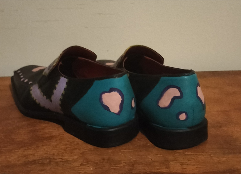 Size 8 hand painted black leather shoes. Words "Hip Hop" on the front of the shoes. Decorated on all areas. Shapes and colours.