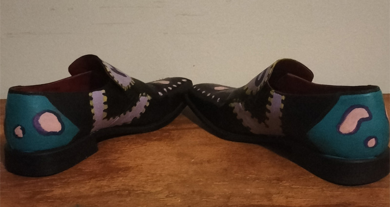 Size 8 hand painted black leather shoes. Words "Hip Hop" on the front of the shoes. Decorated on all areas. Shapes and colours.