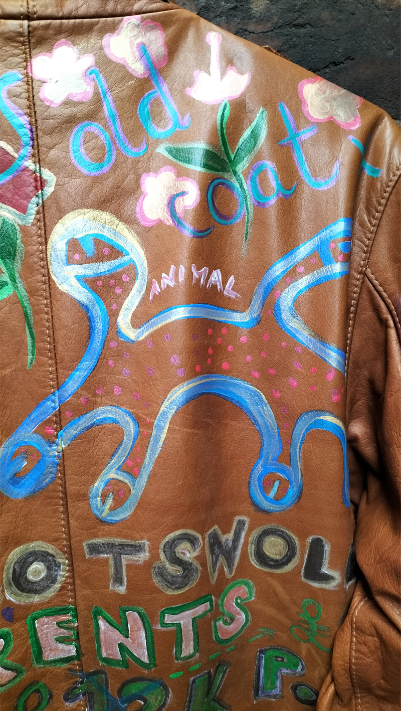 Liam's Old Coat - hand painted vintage parka jacket with hood (brown). Top part of back of jacket. Abstract animal iimage with head and four limbs each with a penis-like tip. The word "animal" over the image. Vintage Rome Peabody Massachusetts USA Size 42 brown leather hooded parka jacket handpainted one off.