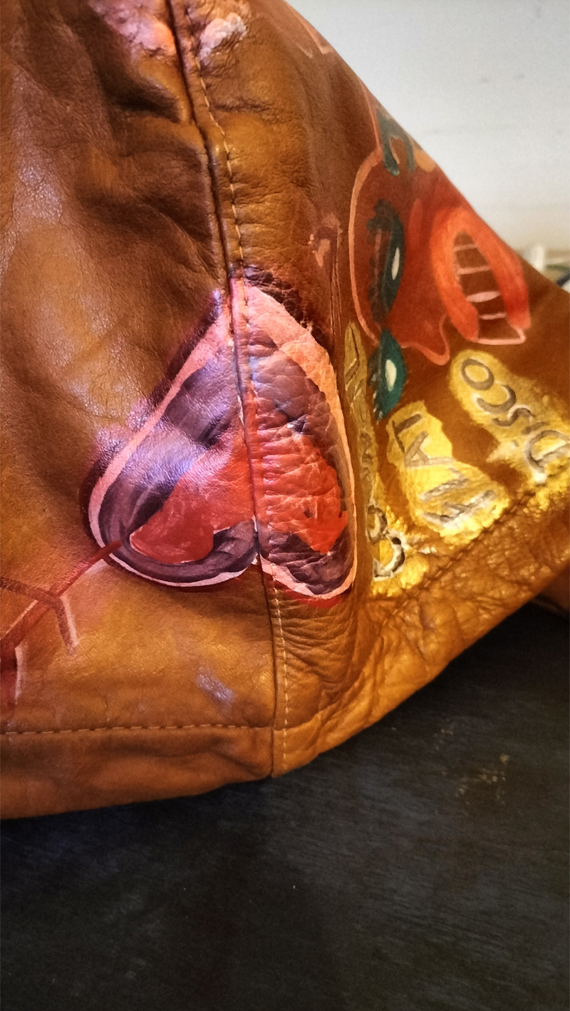 Liam's Old Coat - hand painted vintage parka jacket with hood (brown). Detachable hood comes with the jacket. Hand painted hood on all sides. A heart with an arrow is shown here which sits at the centre of the hood. Vintage Rome Peabody Massachusetts USA Size 42 brown leather hooded parka jacket handpainted one off.