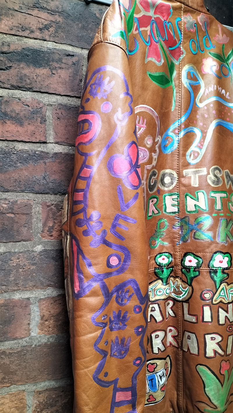 Liam's Old Coat - hand painted vintage parka jacket with hood (brown). Part of back of jacket and one sleeve. Purple abstract figures with the word "love" on the right sleeve. Vintage Rome Peabody Massachusetts USA Size 42 brown leather hooded parka jacket handpainted one off.
