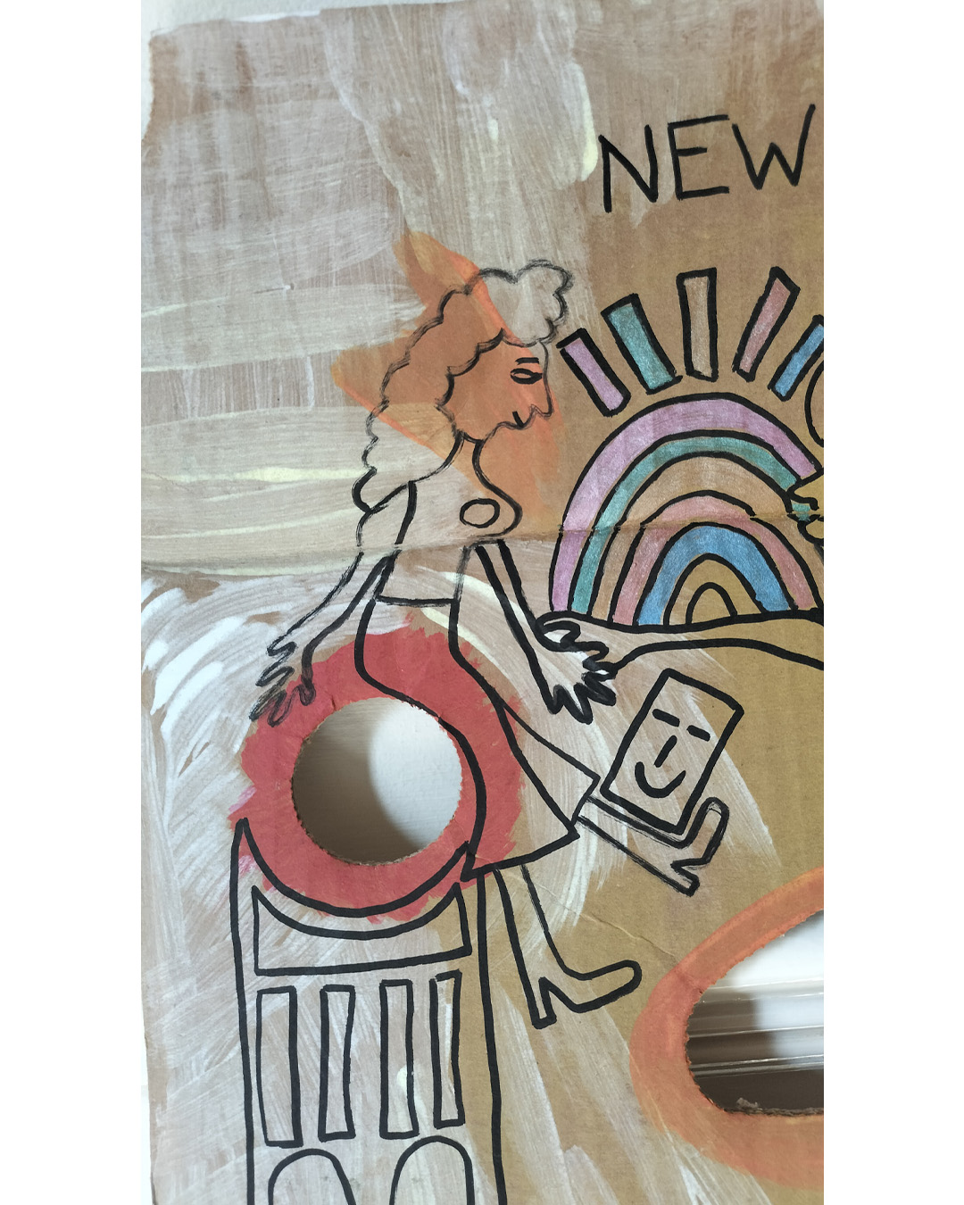 Art work on cardboard. One off. About A3 in size. Square in shape with two round holes (one on each side) and another kidney shaped hole in the middle of the card. The top left and right side of the card are like they have had a semi circle removed. Background: white and orange paint in parts as well as red paint. Two women holding hands, one reaching out to the other. One looks like she is sat on a tall object with a kind of mosaic surface. A bit like a tower. A kind of Pharoah-like figure at the top right of the art work. Blue and pink objects forming some kind of arch and then some oblong shapes above. Colours are alternated throughout. A little card shape with a smiling face near the one foot of each of the women. The art work is about a live music venue in South East London, the New Cross Inn.